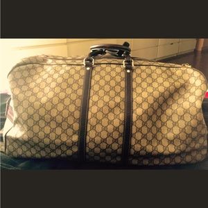 Large Gucci carry on with wheels